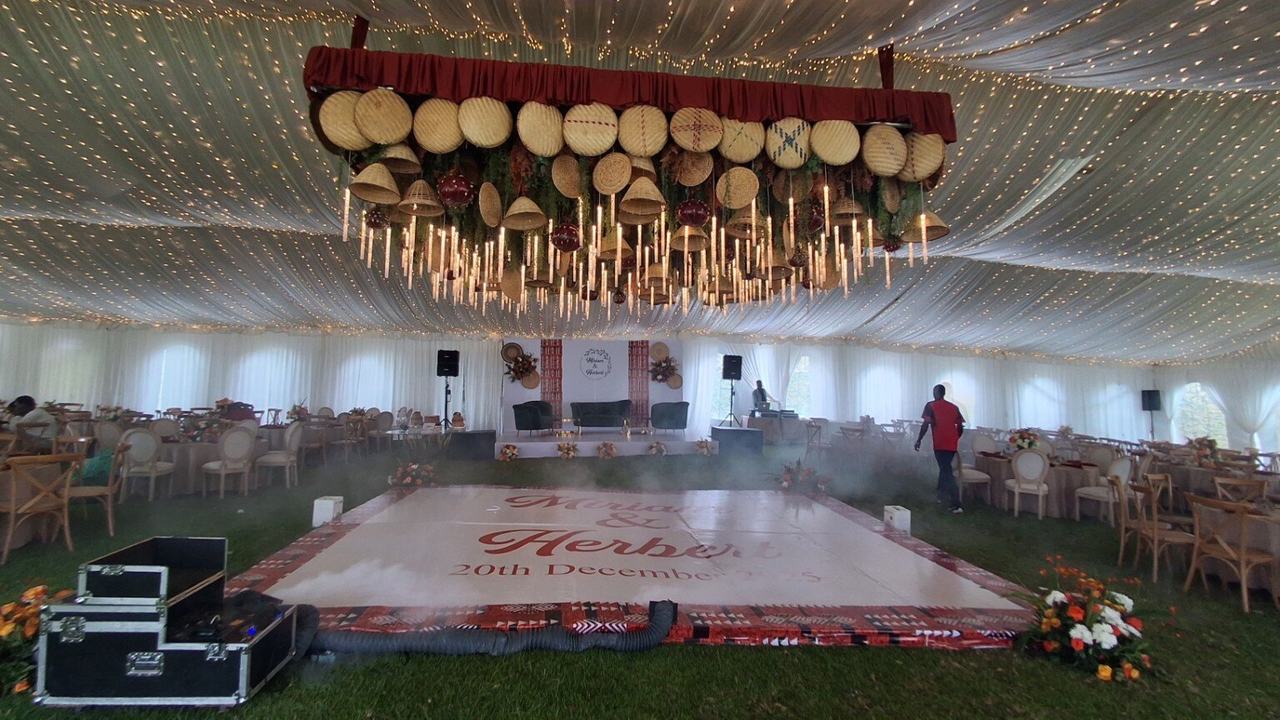 Elegant wedding reception tent with statement ceiling décor