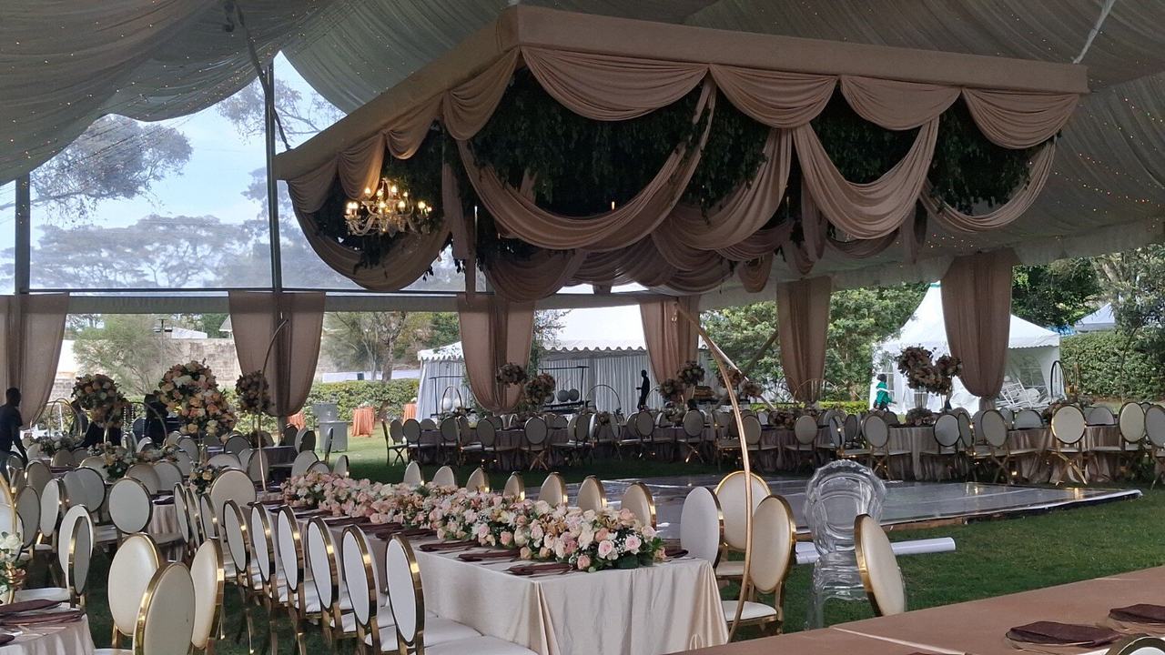 Outdoor reception with draping and statement décor