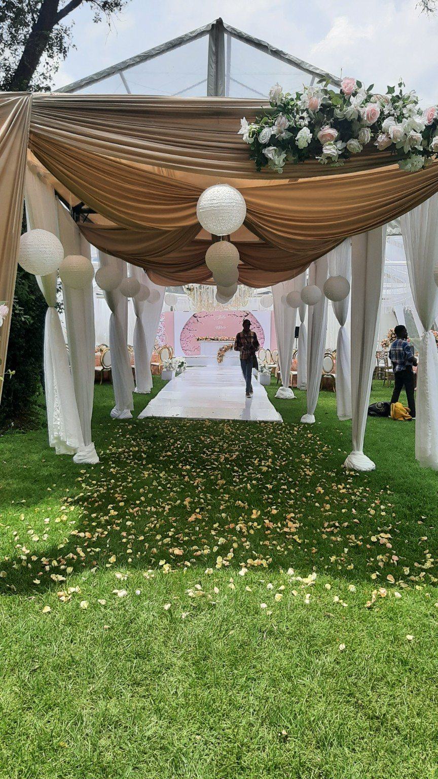 Draped entrance walkway leading guests into an elegant wedding reception